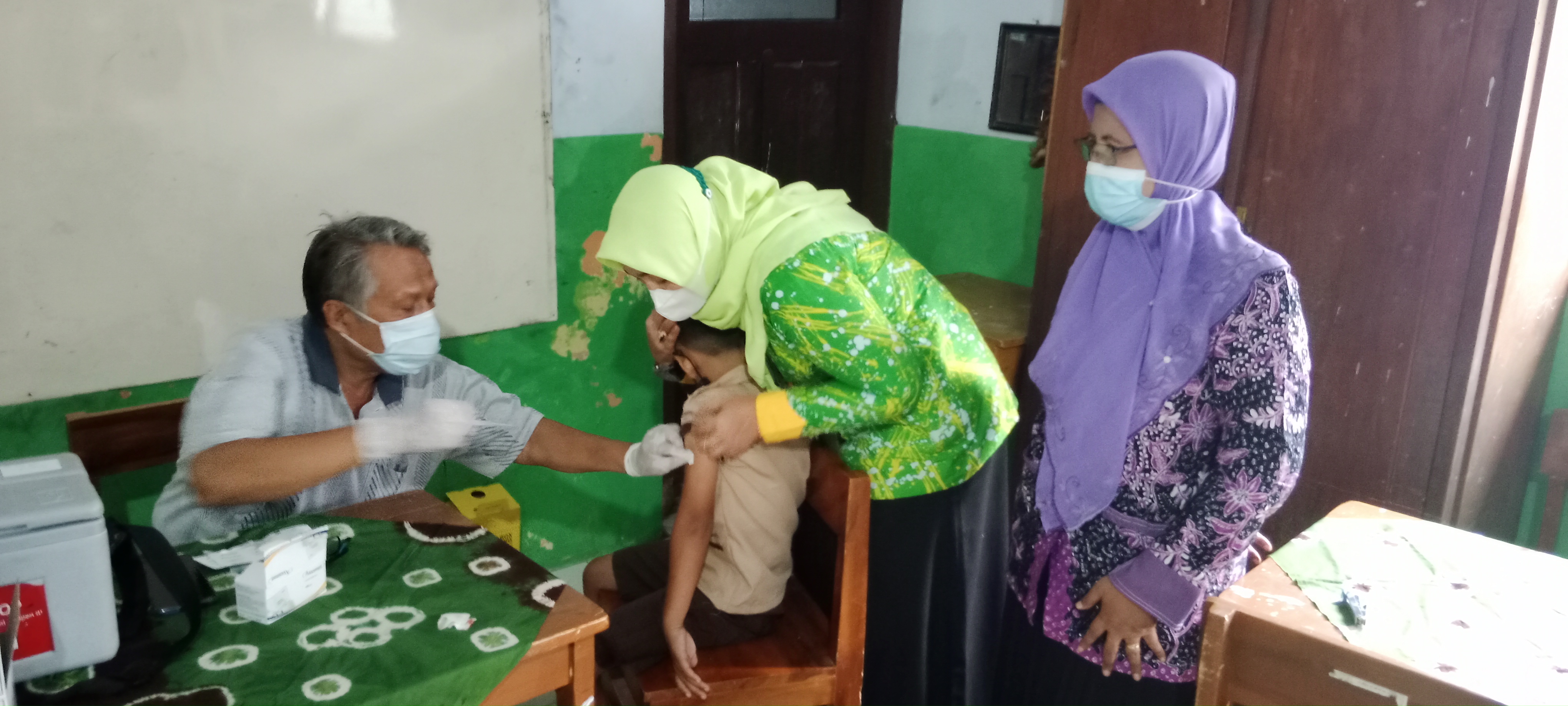 VAKSINASI ANAK DI BAWAH UMUR 12 TAHUN”